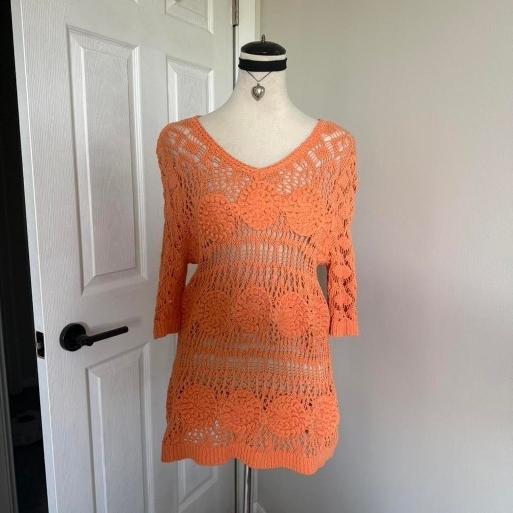 Orange crochet 3/4 sleeve top with floral pattern